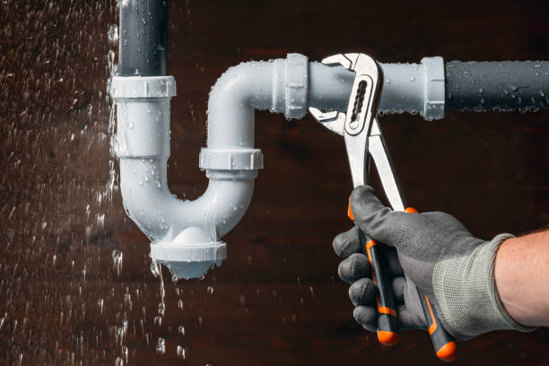 Professional Plumbing technician working in Lore City, OH